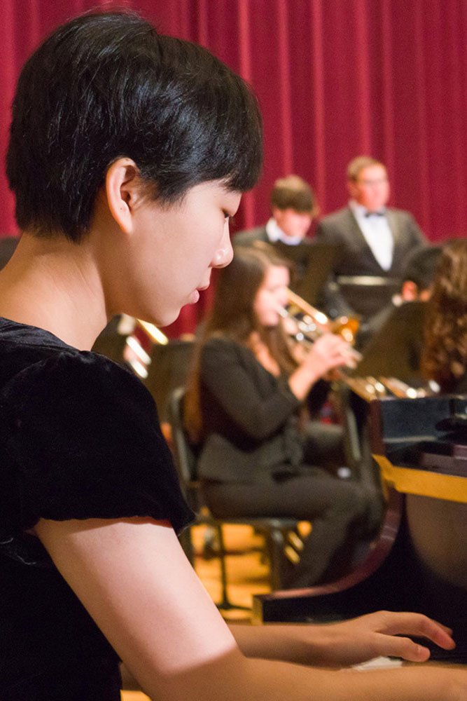 Capital student playing the piano