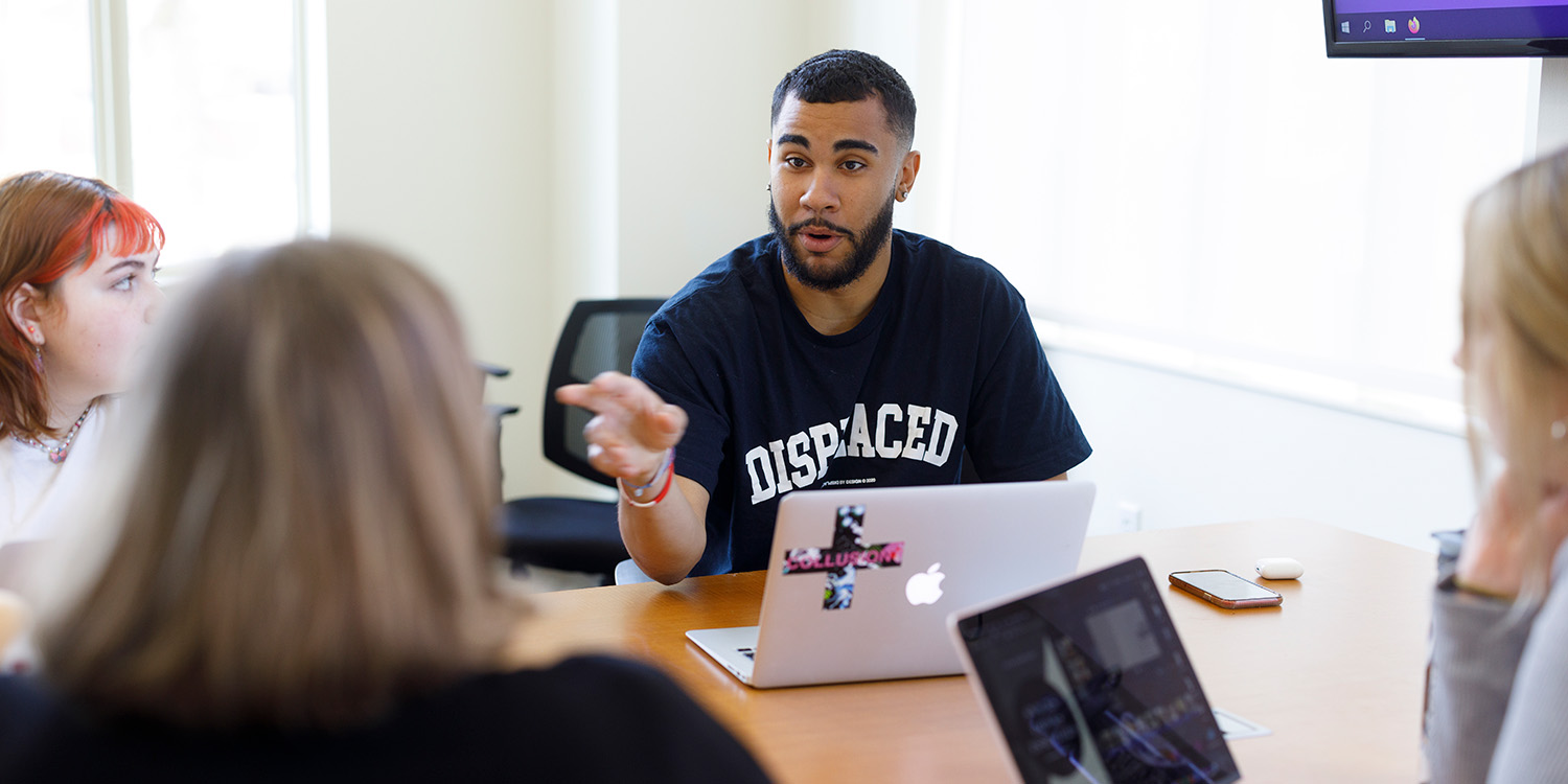 Male Student In Classroom Discussion