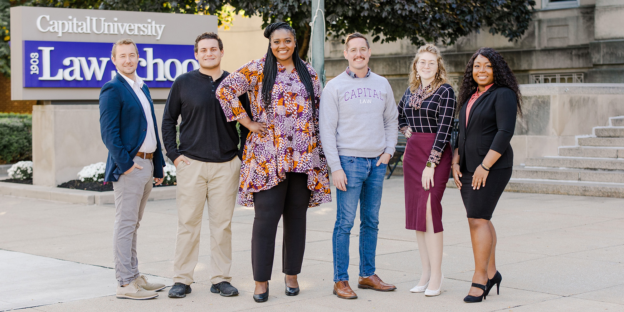 Students Standing In Front Of Law School