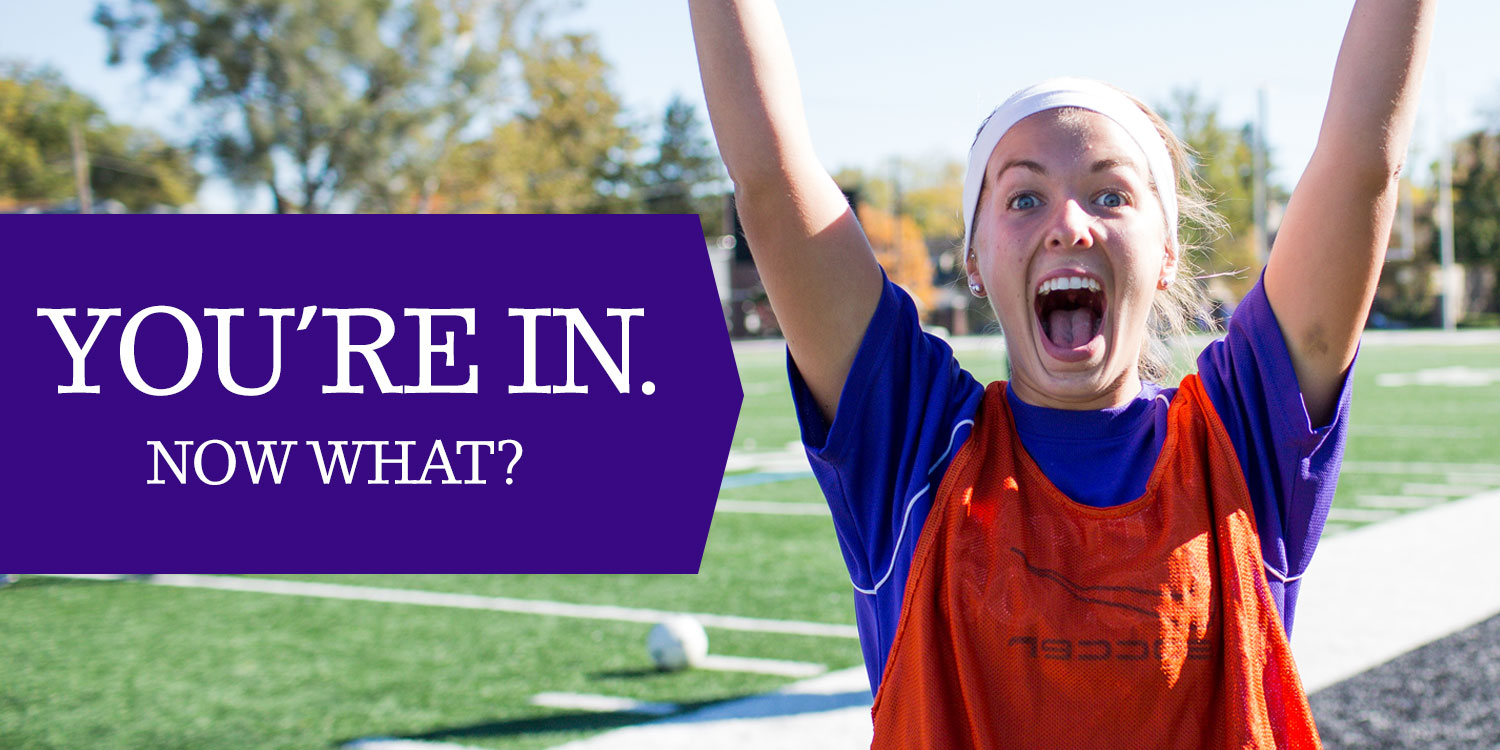 You're in. Now what? Young girl excited with hands raised outside on soccer field.