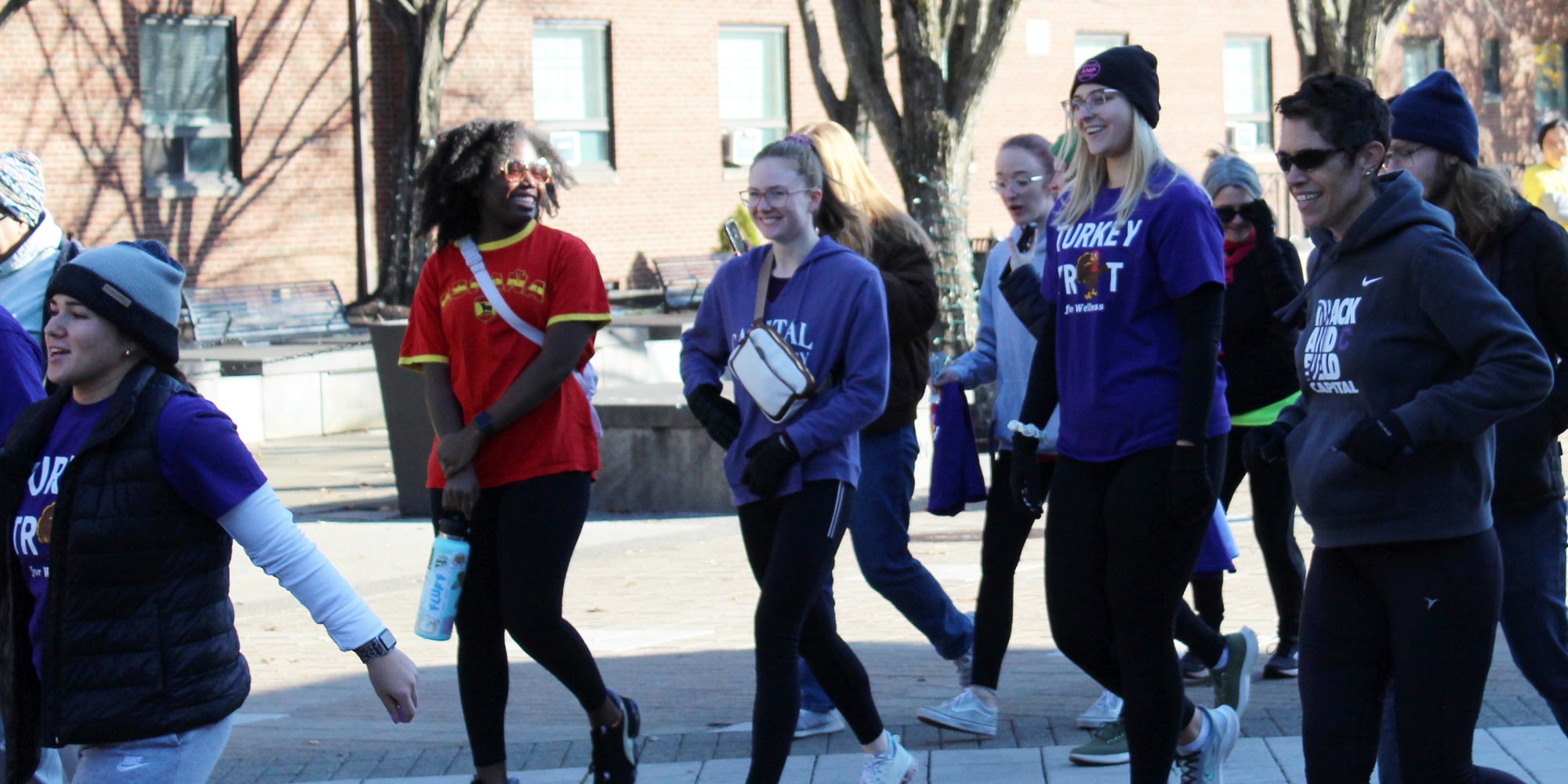 Turkey Trot participants run across the plaza