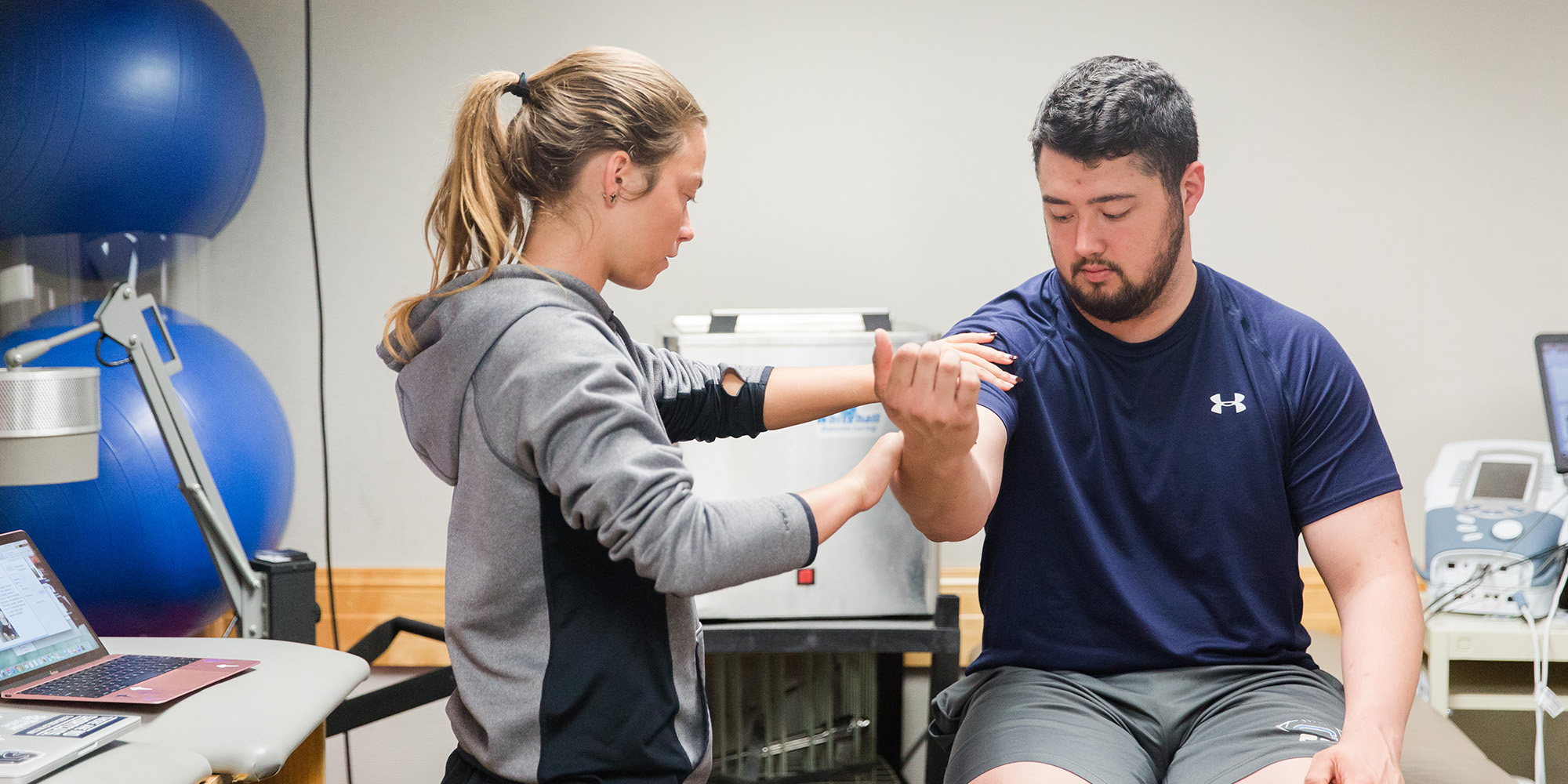 Male And Female Student Training To Be Atthletic Trainers